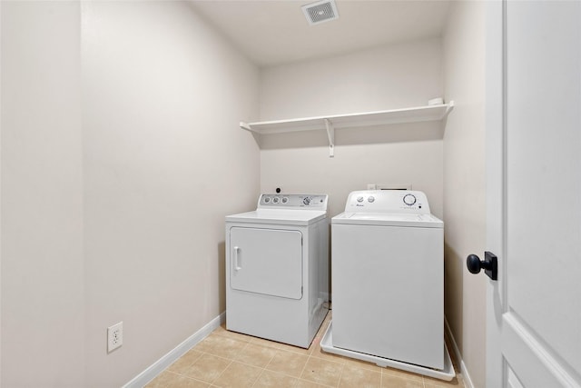 laundry room with washing machine and dryer