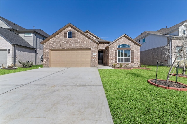 view of front of home featuring a front lawn and a garage