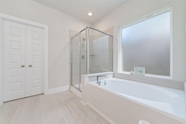 bathroom featuring plus walk in shower