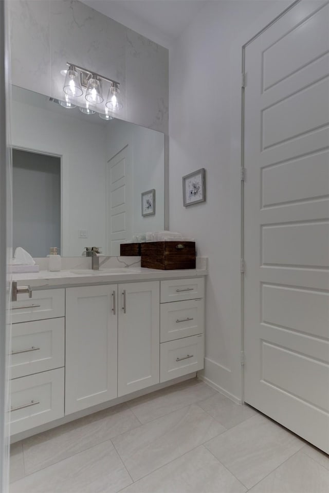 bathroom with tile patterned floors and vanity