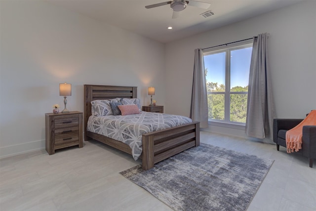 bedroom featuring ceiling fan and multiple windows