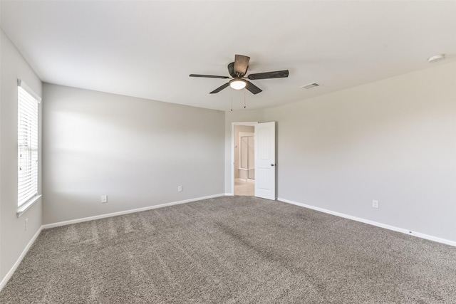 unfurnished room with carpet floors and ceiling fan