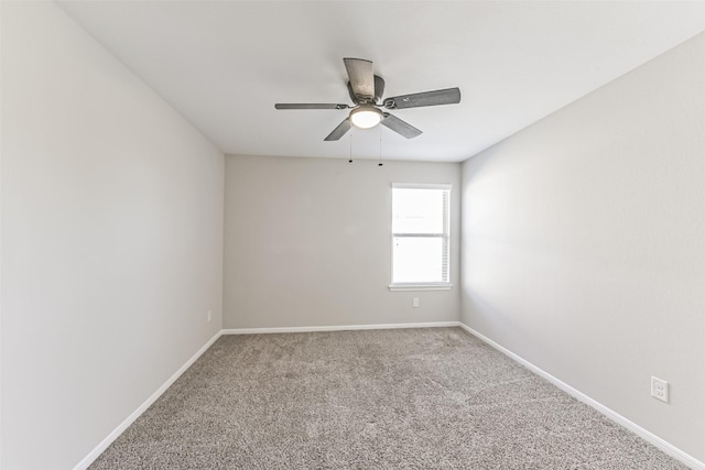 unfurnished room with ceiling fan and carpet floors