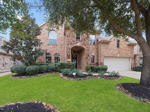 view of front of house featuring a front yard and a garage