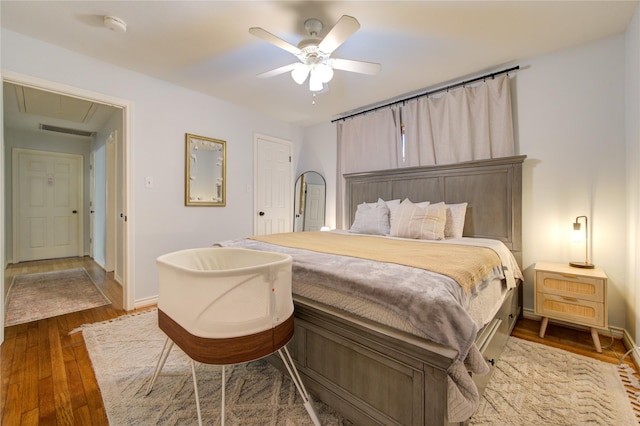 bedroom featuring ceiling fan and hardwood / wood-style floors