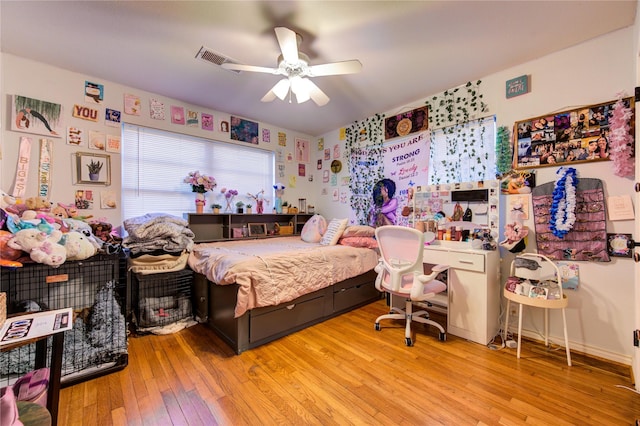 bedroom featuring ceiling fan and light hardwood / wood-style flooring