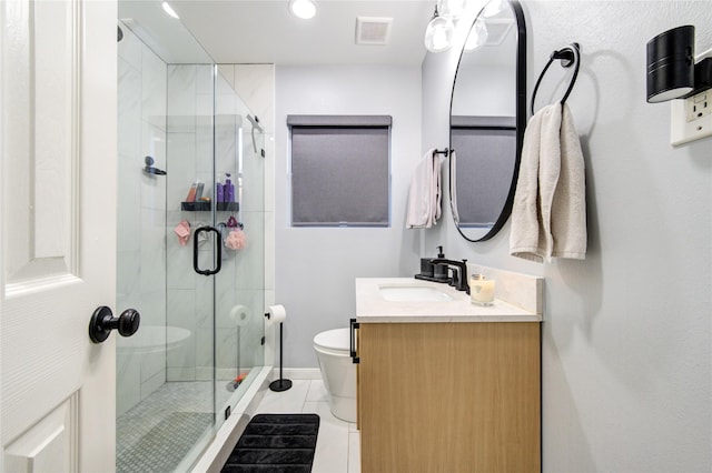 bathroom featuring toilet, tile patterned floors, walk in shower, and vanity