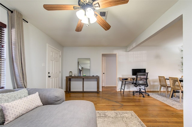 interior space featuring ceiling fan and wood-type flooring