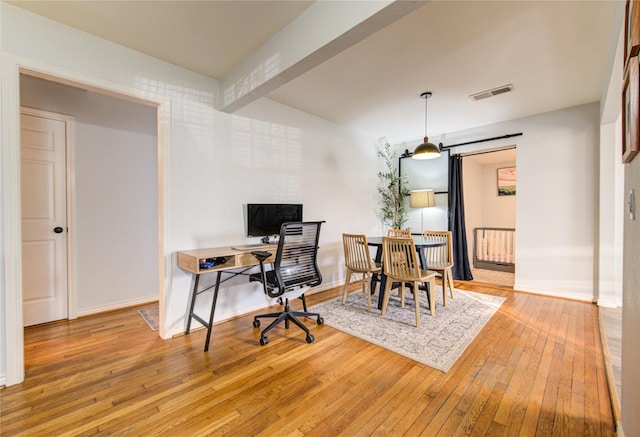 office space with hardwood / wood-style flooring