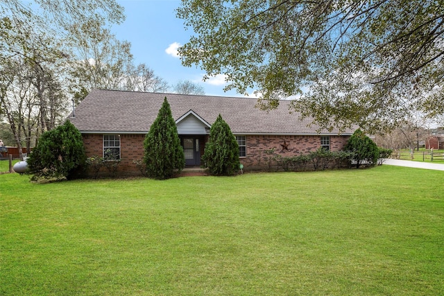 ranch-style home with a front lawn