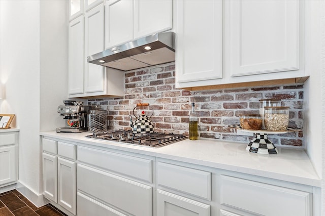 kitchen featuring white cabinets and stainless steel gas cooktop