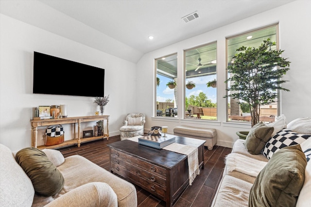 living room featuring vaulted ceiling