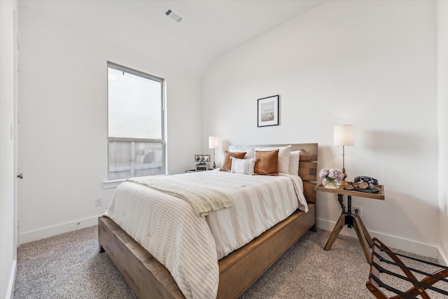 carpeted bedroom featuring lofted ceiling