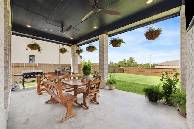 view of patio featuring ceiling fan and a grill