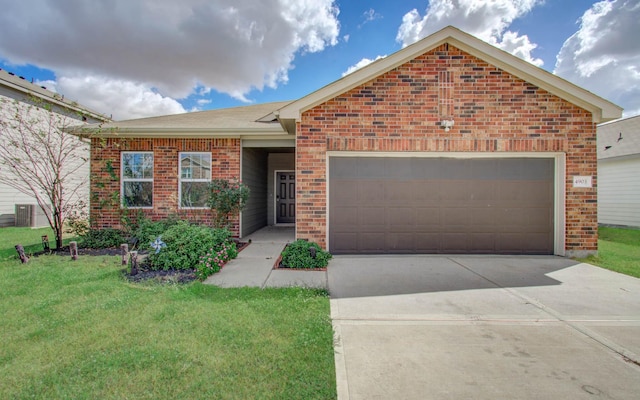 view of front of house featuring a front lawn and a garage