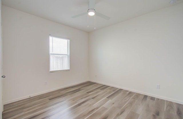 spare room with ceiling fan and light hardwood / wood-style floors