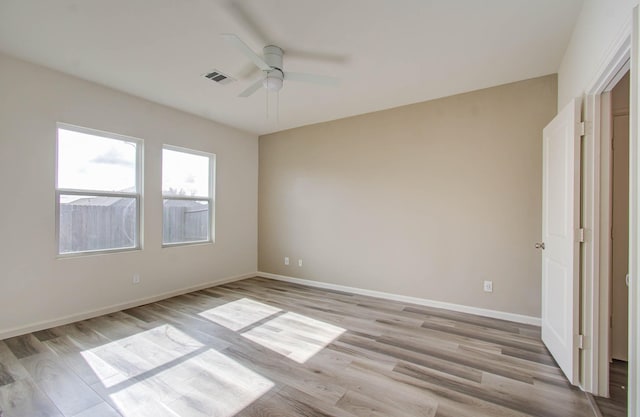 unfurnished bedroom with ceiling fan and light wood-type flooring