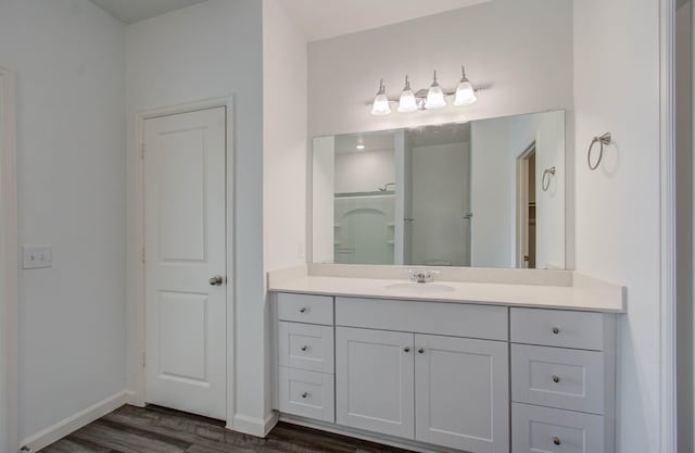 bathroom featuring vanity and hardwood / wood-style floors