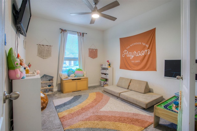 interior space with carpet floors and ceiling fan