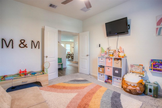 recreation room featuring carpet floors and ceiling fan