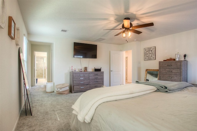 bedroom with ceiling fan and light carpet