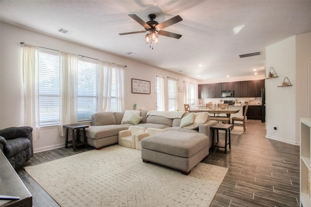 living room featuring ceiling fan