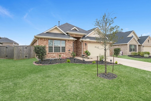 view of front of property with a front lawn and a garage