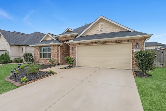 view of front of property featuring a garage and a front lawn