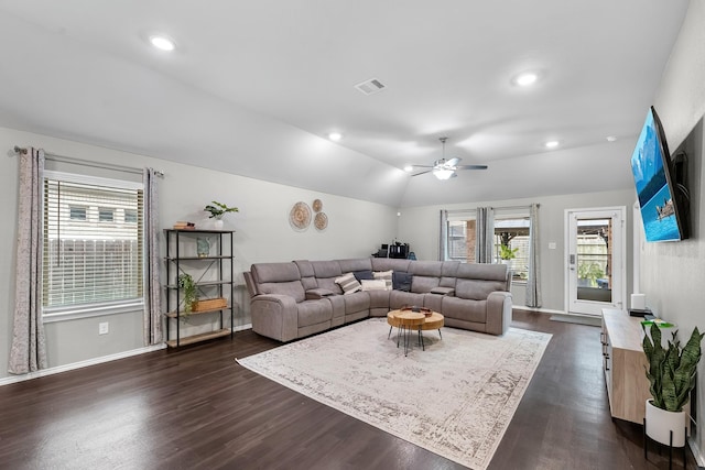 living room featuring lofted ceiling, dark hardwood / wood-style flooring, and ceiling fan