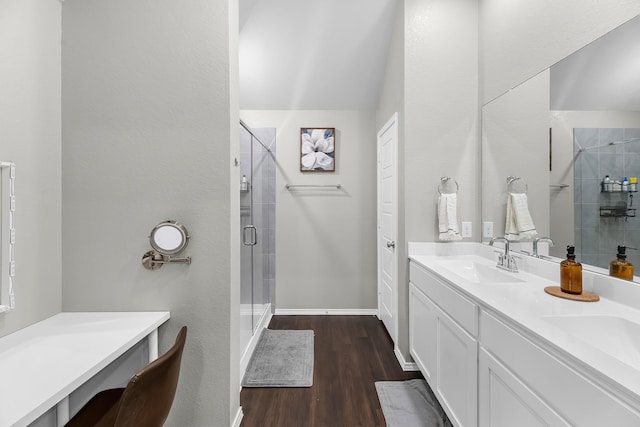 bathroom with vanity, walk in shower, and hardwood / wood-style floors