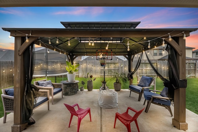 patio terrace at dusk with a gazebo and a trampoline