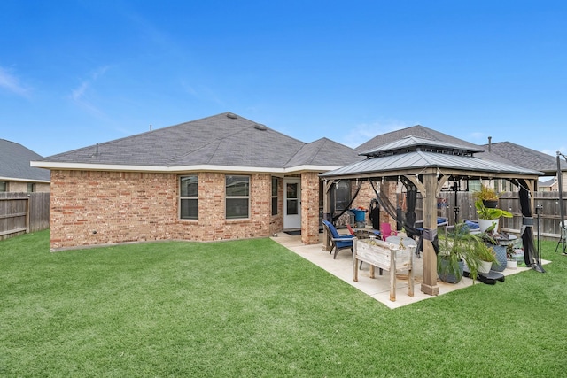 back of house with a lawn, a gazebo, and a patio