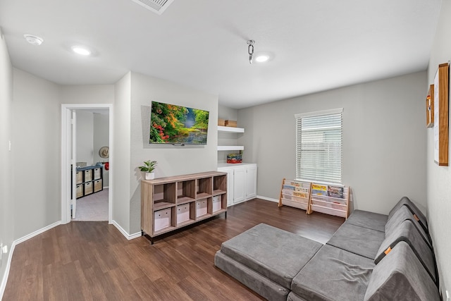 living room with dark hardwood / wood-style flooring