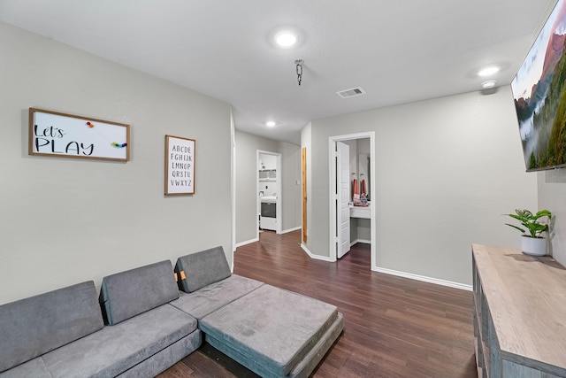 living room with dark hardwood / wood-style floors