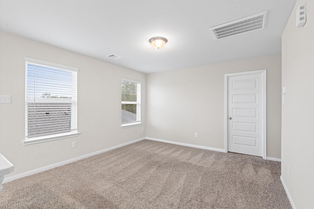 spare room featuring carpet flooring