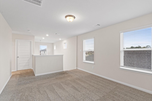 view of carpeted spare room