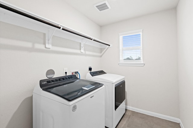 clothes washing area featuring washing machine and dryer