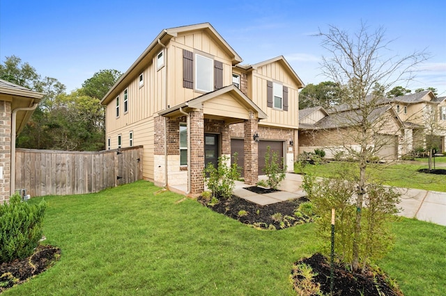 view of front of property with a front yard and a garage