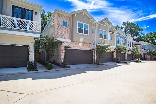 multi unit property featuring a garage