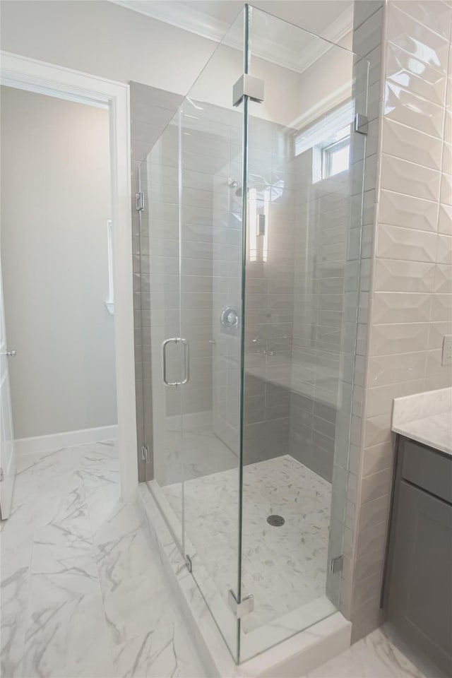 bathroom featuring an enclosed shower and crown molding