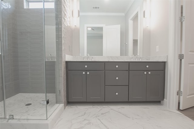 bathroom with a shower with door, vanity, and ornamental molding