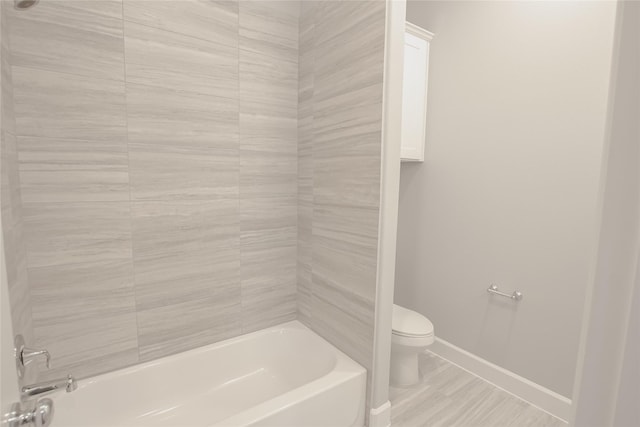 bathroom with toilet and shower / tub combination