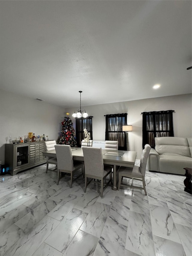 dining room featuring a chandelier