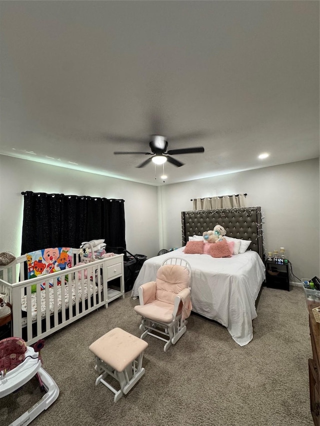 bedroom with ceiling fan and carpet