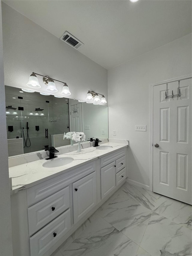 bathroom with an enclosed shower and vanity