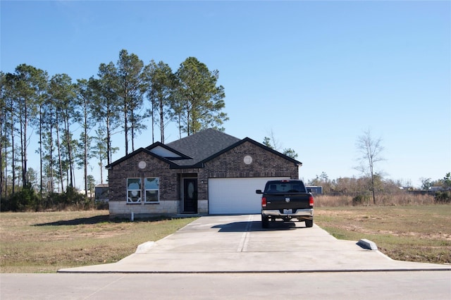 view of front facade with a front lawn and a garage