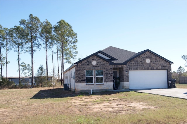 single story home featuring central air condition unit, a front lawn, and a garage