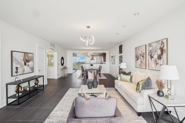 living room featuring a notable chandelier and crown molding