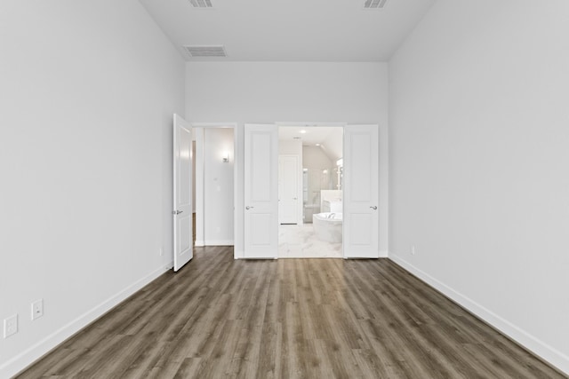 spare room with dark hardwood / wood-style flooring