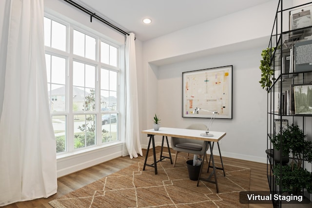 office space with hardwood / wood-style floors